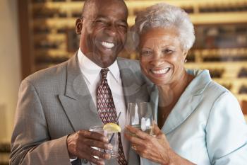 Royalty Free Photo of a Couple Having a Drink at a Bar