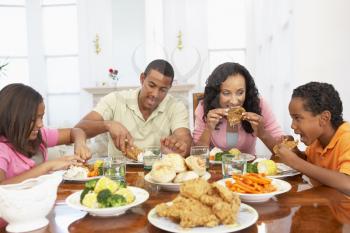 Royalty Free Photo of a Family Having a Meal at Home