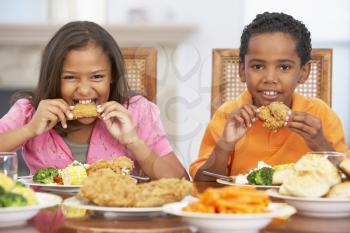 Royalty Free Photo of Children Having a Meal