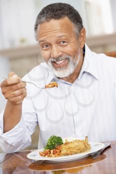 Royalty Free Photo of a Man Enjoying a Meal
