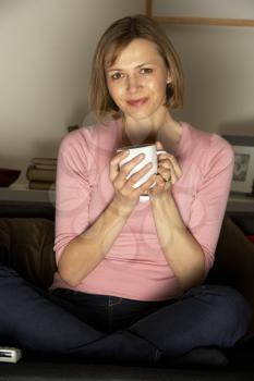 Royalty Free Photo of a Woman With a Cup of Coffee