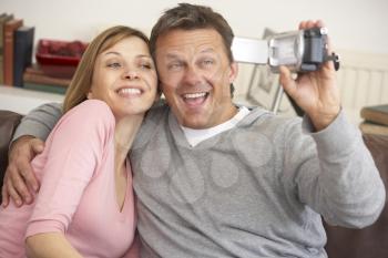 Royalty Free Photo of a Couple With a Video Camera