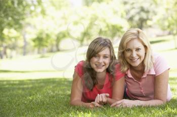 Royalty Free Photo of a Mother and Daughter Lying on the Grass