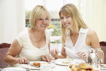 Royalty Free Photo of Two Women Having Breakfast at a Hotel
