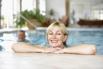 Royalty Free Photo of a Middle Aged Couple in a Pool