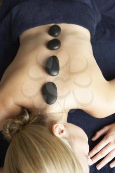 Royalty Free Photo of a Woman Having a Hot Stone Massage