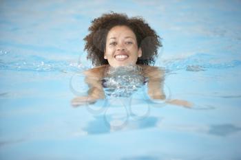 Royalty Free Photo of a Young Woman in a Pool