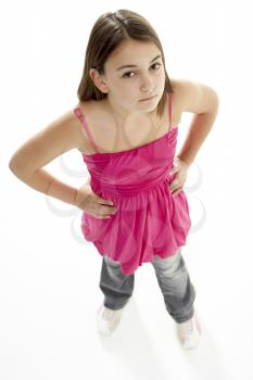 Royalty Free Photo of a Young Girl With Her Hands on Her Hips