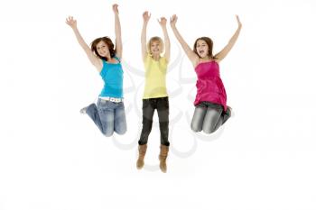 Group Of Three Young Girls Leaping In Air