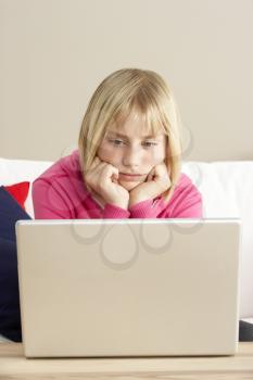 Royalty Free Photo of a Girl With a Laptop
