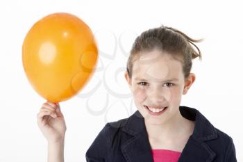 Royalty Free Photo of a Young Girl With a Balloon
