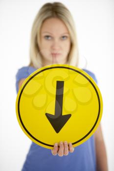 Royalty Free Photo of a Woman With a Arrow Sign