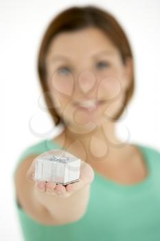 Royalty Free Photo of a Woman Holding a Small Gift