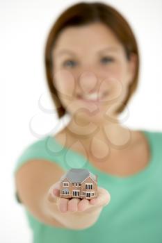 Royalty Free Photo of a Girl With a Small House