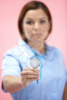 Royalty Free Photo of a Woman Holding a Stethoscope