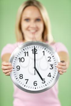 Royalty Free Photo of a Woman With a Clock