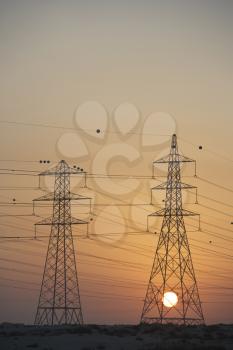 Royalty Free Photo of Hydro Towers at Sunset