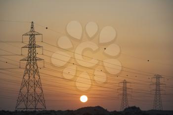 Royalty Free Photo of Hydro Towers at Sunset