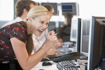 Royalty Free Photo of a Group of People at Computers and a Happy Woman