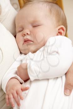 Royalty Free Photo of a Mother With a Sleeping Baby