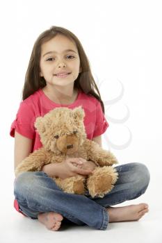 Studio Portrait Of Smiling Girl with Teddy Bear