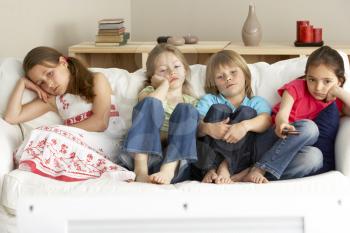 Royalty Free Photo of Children Watching Television