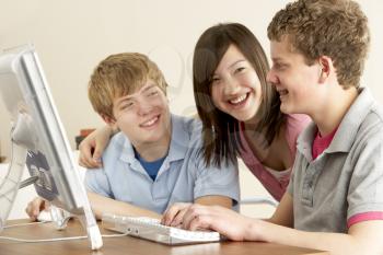 Royalty Free Photo of Teens at a Computer