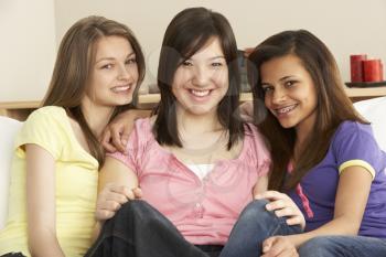 Royalty Free Photo of Teenage Girls on a Couch
