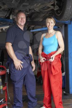 Royalty Free Photo of a Mechanic and Female Apprentice