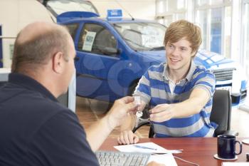 Royalty Free Photo of a Teen Buying a Car