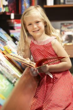 Royalty Free Photo of a Child in a Bookstore