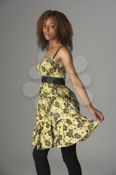 Royalty Free Photo of a Girl in a Yellow Dress