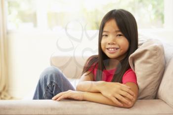 Royalty Free Photo of a Little Girl on a Couch