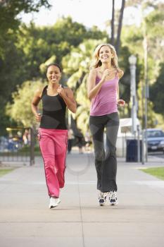 Royalty Free Photo of Two Women Jogging in the City