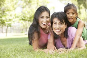 Royalty Free Photo of Three Generations of Women Lying on the Grass