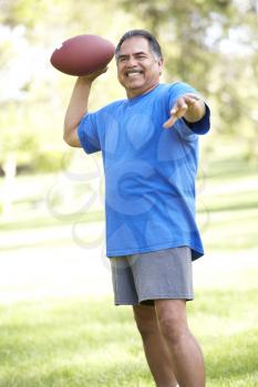 Royalty Free Photo of a Man With a Football