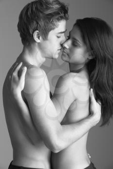 Portrait Of Semi-Naked Couple Kissing
