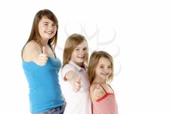 Three Girls Giving Thumbs Up Gesture In Studio