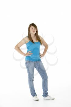 Royalty Free Photo of a Teenage Girl With Her Hands on Her Hips
