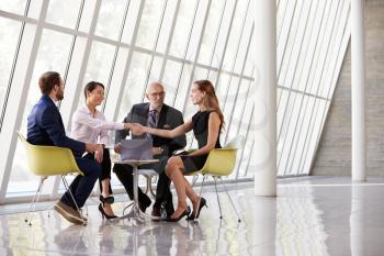 Group Business Meeting In Reception Of Modern Office