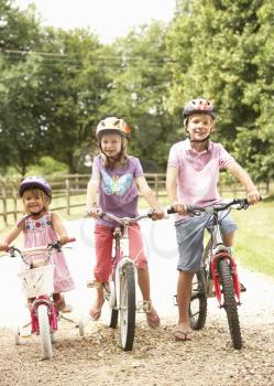 Children In Countryside Wearing Safety Helmets