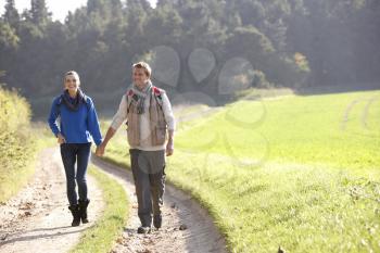 Young couple walking in park