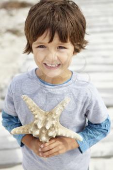 Young boy with starfish