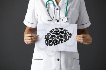 American nurse holding ink drawing of brain