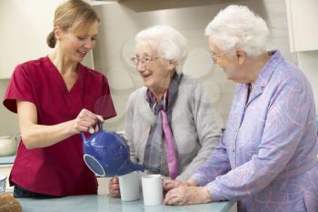 Senior women at home with carer