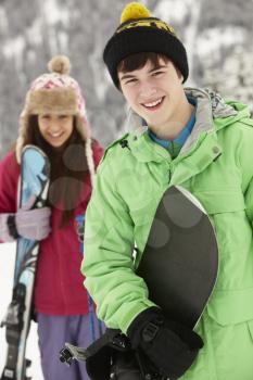 Two Teenagers On Ski Holiday In Mountains