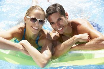 Couple Having Fun In Swimming Pool
