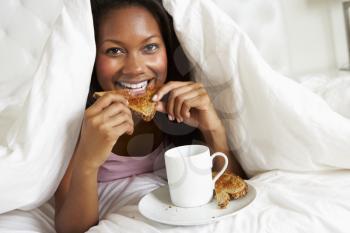 Woman Enjoying Breakfast In Bed