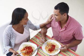 Overhead View Of Couple Eating Meal Together