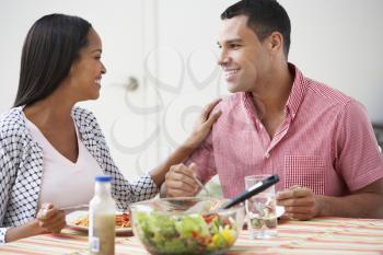 Couple Eating Meal Together At Home